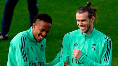 Gareth Bale and Brazilian defender Eder Militao share a joke. AFP