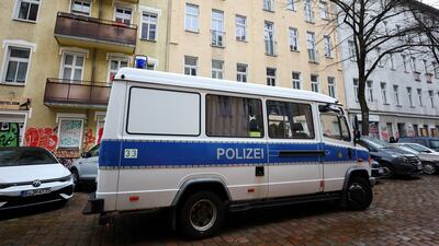 A German police vehicle is parked in front an apartment in Berlin during the raids. Reuters