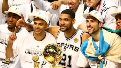 San Antonio Spurs’ big three; Tony Parker, Tim Duncan and Manu Ginobili celebrate defeating the Miami Heat in Game Five of the 2014 NBA Finals. Andy Lyons / Getty Images / AFP