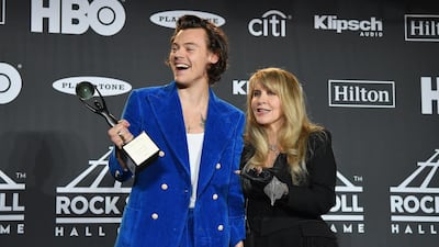 Harry Styles and inductee Stevie Nicks pose together. AFP