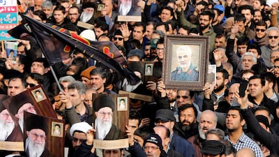 Iranians holding pictures of Khamenei and Suleimani take to the streets during an anti-US demonstration in Tehran. EPA