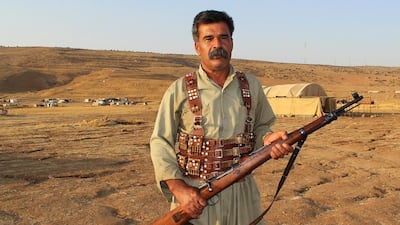 Faris Salih Faris, 48, is ready to defend his people with his WWII-era Soviet rifle. Florian Neuhof for The National