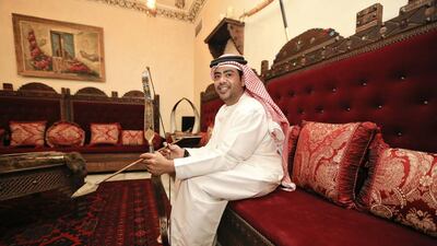 Emirati Salah Al Junaibi shows off a 200-year-old Indian bow and arrow set made of Damascus metal. Mr Al Junaibi has an Islamic and UAE heritage museum in his house in Abu Dhabi. Sarah Dea/The National