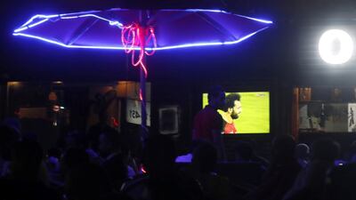 Egyptian soccer fans watch Liverpool's Egyptian forward Mohamed Salah during his World Cup qualifiers match between Egypt and Gabon on a screen at a cafe in Cairo, on September 5. Reuters