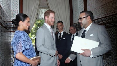 Prince Harry and Meghan, the Duchess of Sussex, are greeted by King Mohammed VI of Morocco, at his residence, on the third and final day of their tour of Morocco. AP