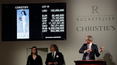 Global president of Christie's Jussi Pylkkanen, right, guides the bidding for Pablo Picasso's Fillette a la Corbeille Fleurie, which sold for $115 million during an auction from the collection of Peggy and David Rockefeller. AP Photo/Julie Jacobson