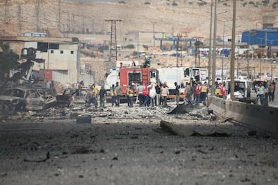 White Helmets rescuers at the site of the explosion. AFP
