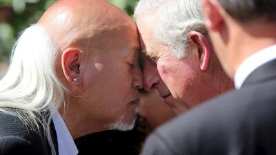 Britain’s Prince Charles exchanges a hongi, a traditional Maori greeting, with a local during a walkabout in Auckland’s Aotea Square, New Zealand. Michael Bradley / Reuters / Pool