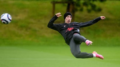 Kostas Tsimikas tries the spectacular. Getty