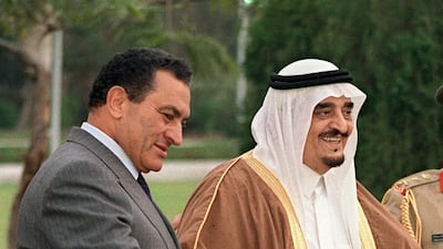 King Fahd bin Abdul Aziz of Saudi Arabia smiles as Egyptian President Hosni Mubarak welcomes him 27 March 1989 in Cairo. AFP