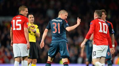 Bastian Schweinsteiger of Bayern Munich waves his finger at Wayne Rooney of Manchester United after he received a red card on Tuesday night. Michael Regan / Bongarts / Getty Images / April 1, 2014