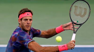 Juan Martin del Potro, of Argentina, hits a return shot to Dominic Thiem, of Austria. Adam Hunger / AP Photo