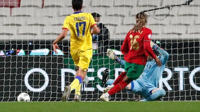 Portugal's Renato Sanches, centre, scores his team's third goal. AP