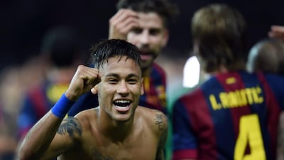 Barcelona’s Brazilian forward Neymar da Silva Santos Junior celebrates after the UEFA Champions League Final football match between Juventus and FC Barcelona at the Olympic Stadium in Berlin on June 6, 2015. FC Barcelona won the match 1-3. AFP PHOTO / PATRIK STOLLARZ