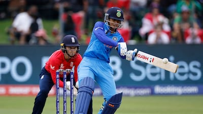 India's Smriti Mandhana plays a shot as England's wicketkeeper Amy Jones looks on during their Group B match at the Women's T20 World Cup in Gqeberha on February 18, 2023. Both teams have qualified for the semi-finals. AFP
