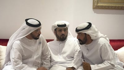 Sheikh Hamdan bin Zayed , Ruler’s Representative in Al Dhafra Region, left, offers condolences. Hamad Al Kaabi / Crown Prince Court - Abu Dhabi