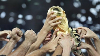 The 2006 FIFA World Cup trophy is shown in the hands of cheering Italian players after their win in that year's tournament. A Fifa ruling council January 10, 2017, voted unanimously to expand the World Cup 2026 to 48 teams. Bernd Weissbrod / EPA