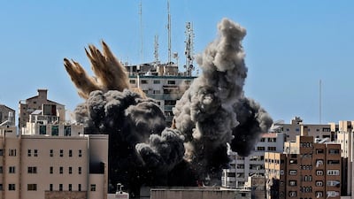 An Israeli air strike destroys the builiding housing the offices of The Associated Press. AFP via AP