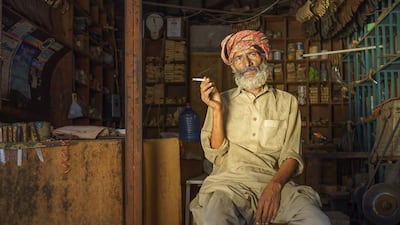 A man takes a cigarette break at a hardware store in Sahiwal, Pakistan. Courtesy Sohail Karmani