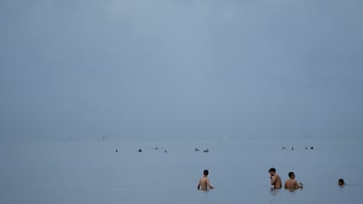 Swimmers in the ocean off Crandon Park in Key Biscayne, Florida. When water temperatures get too high, some of the appeal of swimming is lost. AP