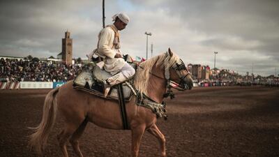 A horse rider prepares to exit after his troupe took part in Tabourida, a traditional horse riding show also known as Fantasia, in the coastal town of El Jadida, Morocco,