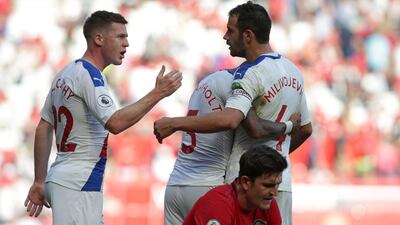 Crystal Palace celebrate their win over Machester United in front of United defender Harry Maguire. AFP