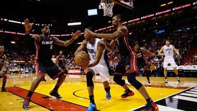 Chrish Bosh added 24 points to help Miami Heat prevail over the Indiana Pacers.