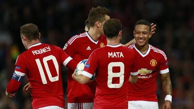 Memphis Depay, right, will return to his former club PSV EIndhoven for Manchester United's first Uefa Champions League group game. Jason Cairnduff / Reuters