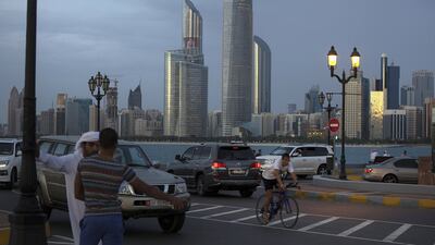 People enjoy a cool, windy evening at the Breakwater Corniche in Abu Dhabi.