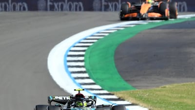 Mercedes driver Lewis Hamilton ahead of McLaren's Lando Norris at the Silverstone. EPA