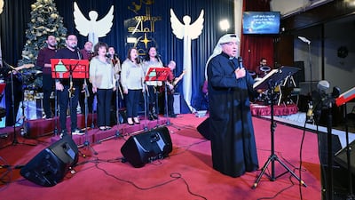 Emmanuel Gharib, chairman of the National Evangelical Church Kuwait and pastor of the Kuwait Presbyterian Church, leads a Christmas mass at a church in Kuwait City. AFP