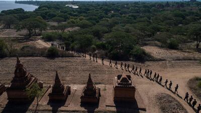Members of a police squad patrol a temple complex in Bagan, in Myanmar's Mandalay Region. AFP