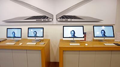Portraits of the late Steve Jobs, co-founder of Apple Inc., illuminate computer monitors in an Apple retail store, in Taipei, Taiwan, Thursday, Oct. 6, 2011. Taiwanese rivals and partners of Apple Inc. lauded company founder Steve Jobs on Thursday, and ne???