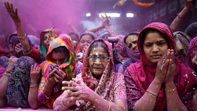 Women offer prayers in Ahmedabad. Amit Dave / Reuters