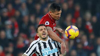Newcastle United's Joselu in action with Liverpool's Dejan Lovren. Reuters