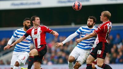 From left to right, Armand Traore of QPR, Michael Doyle of Sheffield United, Charlie Austin of QPR and James McEveley of Sheffield United during their FA Cup third round match on Sunday. Julian Finney / Getty Images