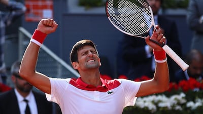 Novak Djokovic celebrates after his first round win over Kei Nishikori at the Madrid Open. Clive Brunskill / Getty Images