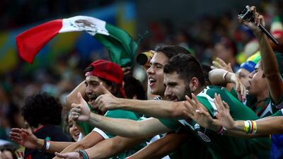 Mexico fans celebrate during their team's win over Croatia on Monday night at the 2014 World Cup in Brazil. Robert Cianflone / Getty Images / June 23, 2014