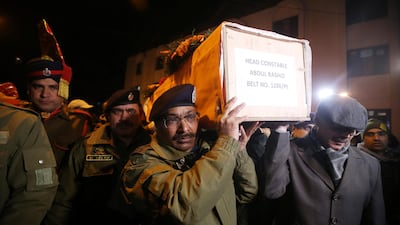 Indian police officers carry the coffin of their fallen colleague, who was killed in a gun battle between suspected militants and security forces in south Kashmir’s Pulwama district. February 18, 2019 - Reuters