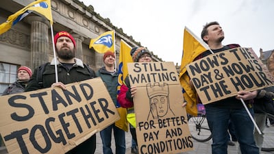 Members of the Public and Commercial Services Union and and University and College Union gather at the Mound in Scotland's capital Edinburgh. PA