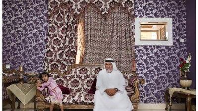 Capt Mohamed Ahmed, 55, with one of his daughters, at his house in Fujairah.