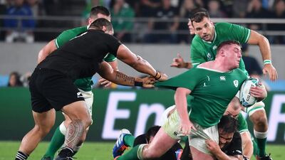 Ireland's prop Tadhg Furlong (R) is tackled during the Japan 2019 Rugby World Cup quarter-final match between New Zealand and Ireland at the Tokyo Stadium in Tokyo. AFP
