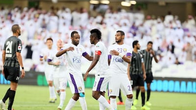 Asamoah Gyan, centre, of Al Ain celebrates scoring a goal during the Arabian Gulf League match against Fujairah at Hazza bin Zayed Stadium in Al Ain on February 28, 2015. Anas Kanni / Al Ittihad