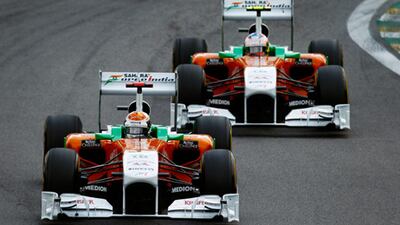 Adrian Sutil, left, leads his Force India teammate Paul di Resta in the Brazilian Grand Prix.