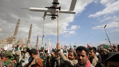 A Houthi supporter holds up a mock drone during a protest against the US and Israel in Sanaa, Yemen. EPA