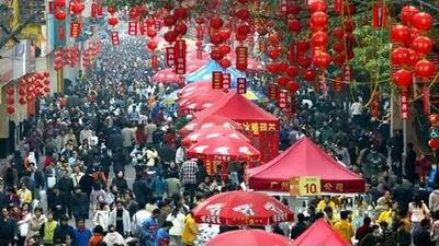 Chinese residents shop at an outdoor market in the southern city of Guangzhou.