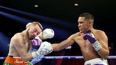 Gabriel Flores Jr. knocks down Matt Conway in the first round during their junior lightweight bout at MGM Grand Garden Arena in Las Vegas. AFP