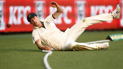 Australia fielder Pat Cummins fails to prevent a boundary. Getty