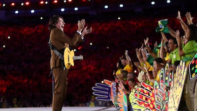 Singer Lenine performs during the Recognition of the Volunteers segment during the closing ceremony. Cameron Spencer / Getty Images