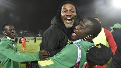 Cameroon manager Rigobert Song celebrates after his team beat Algeria to qualify for the World Cup finals in Qatar. AFP